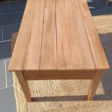 Low farmhouse table in raw wood