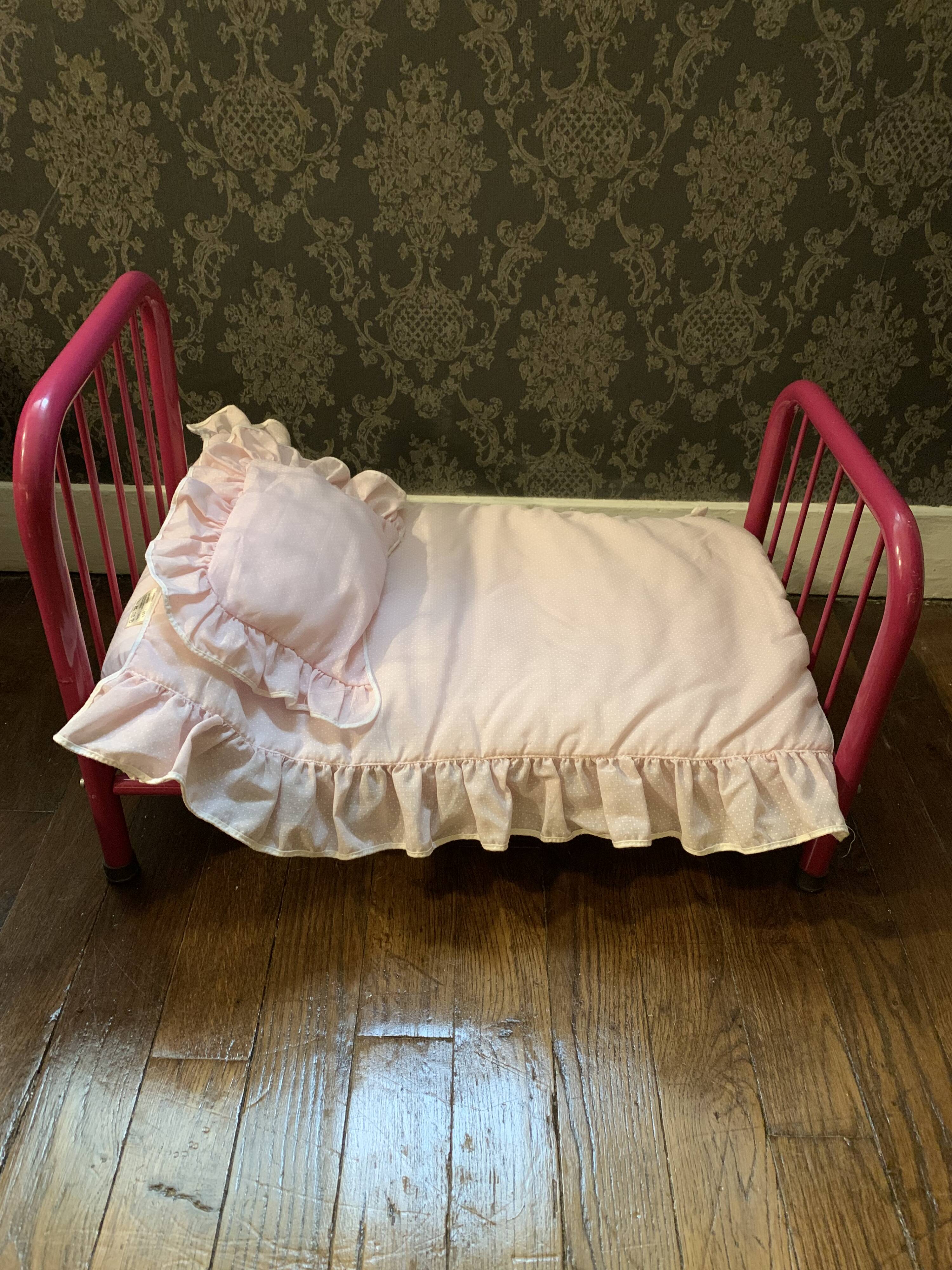 pink metal doll bed