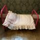pink metal doll bed
