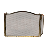 Old brass fireplace set and its fire screen grille