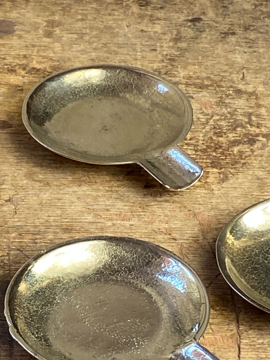 Individual brass ashtrays with storage support