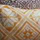 Square orange graphic cushion