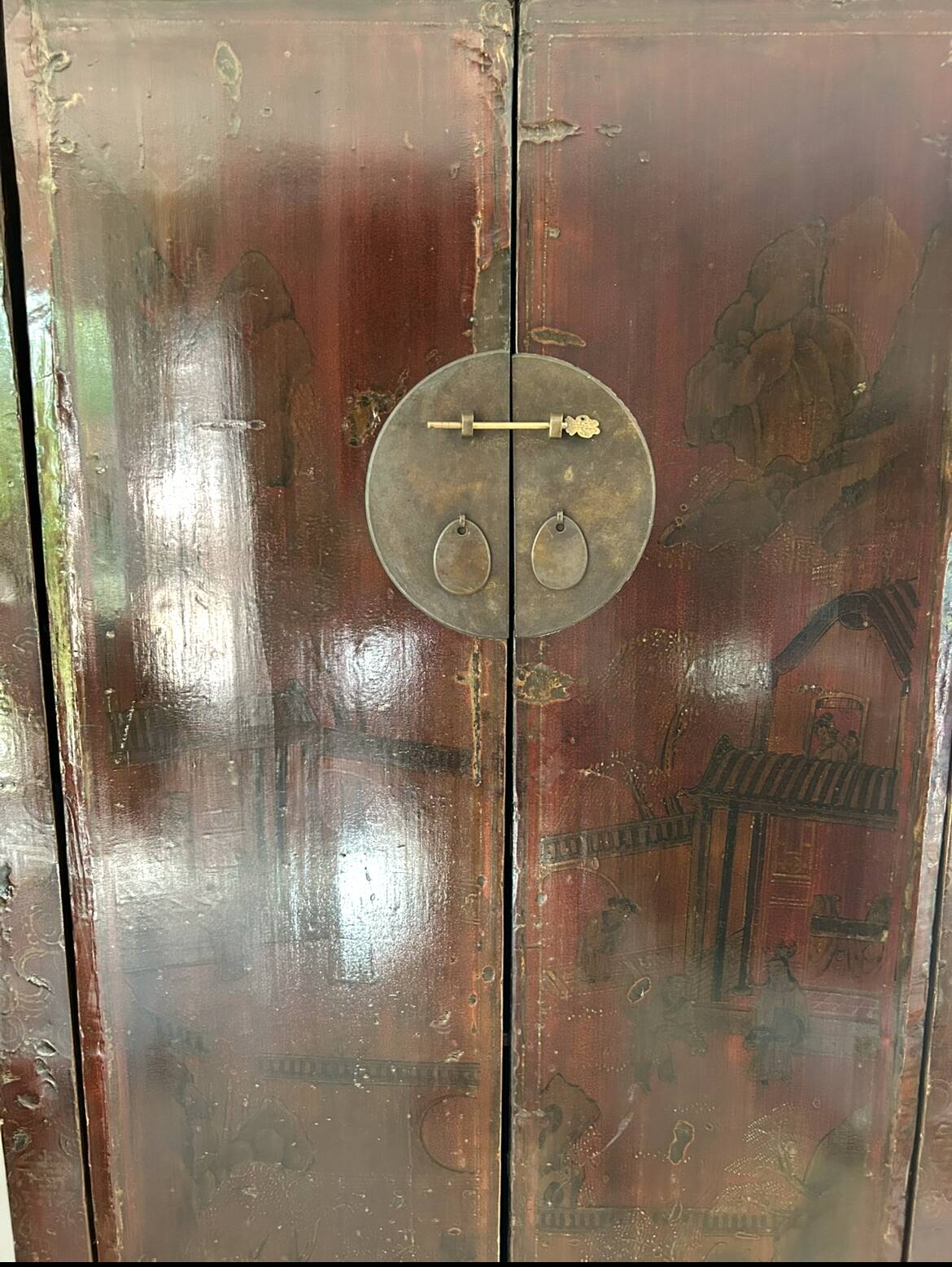 Antique Chinese wardrobe in carved elm.