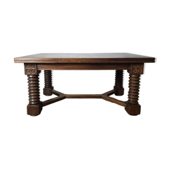 Renaissance-style dining table in solid oak, circa 1940.