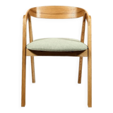 Vintage dining chair in light oak with natural linen pastel green fabric.