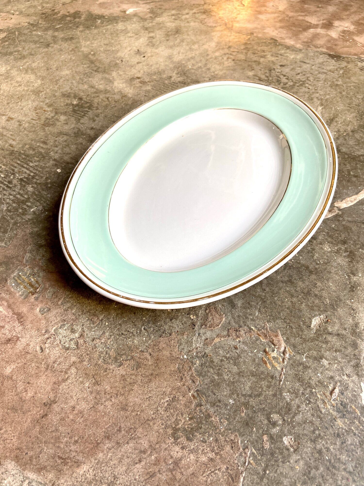 Luneville oval dish in water-green and golden opaque porcelain