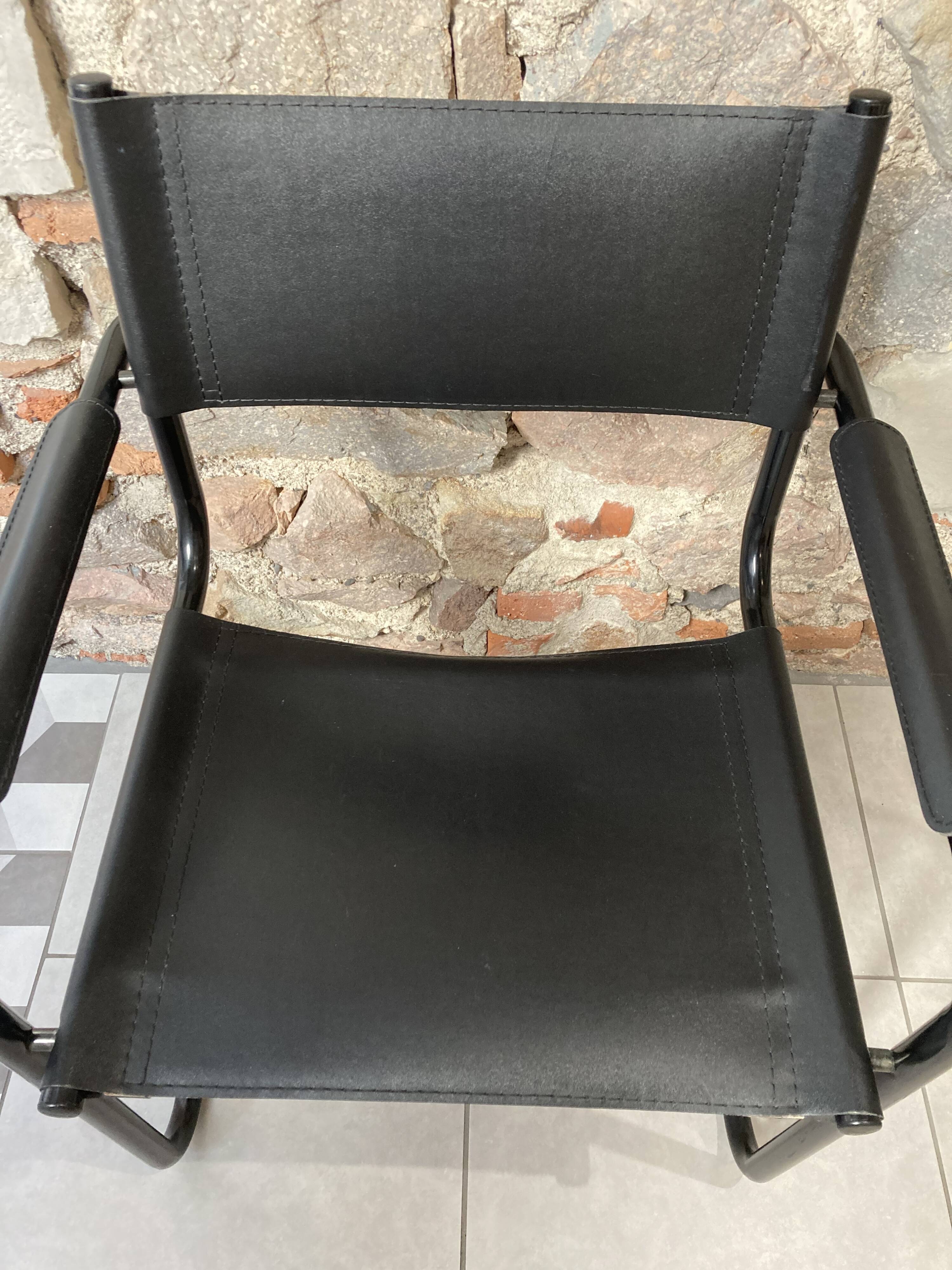 Armchair in black lacquered metal