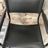 Armchair in black lacquered metal