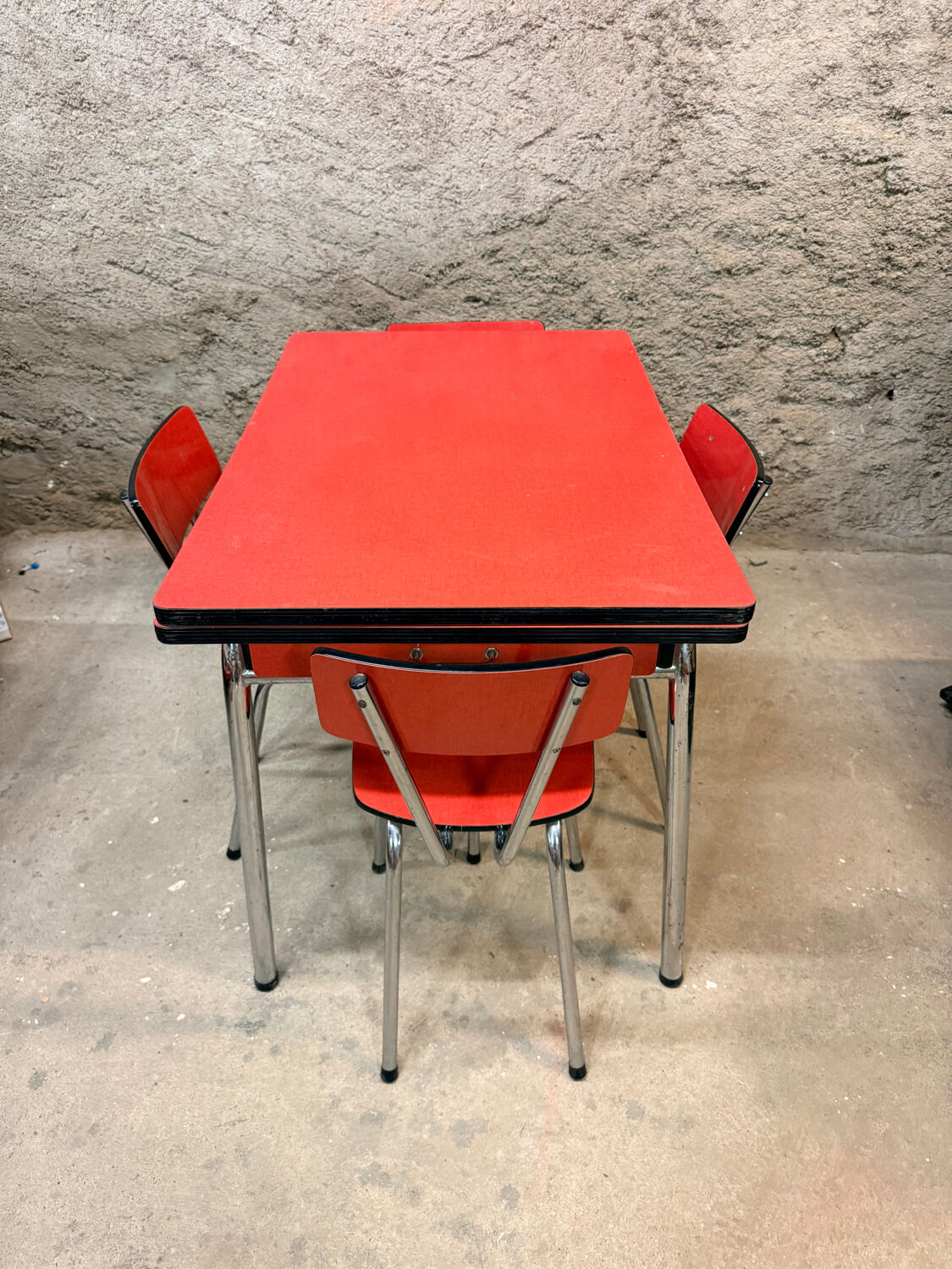 4 red Formica chairs with a 1970s table