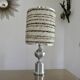 Brushed aluminum and chrome lamp typical of the 70s