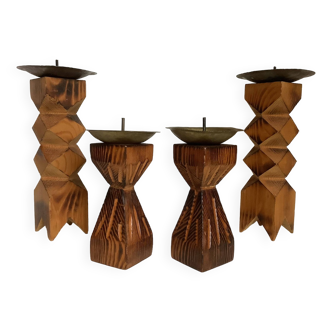 Four wooden and copper candlesticks