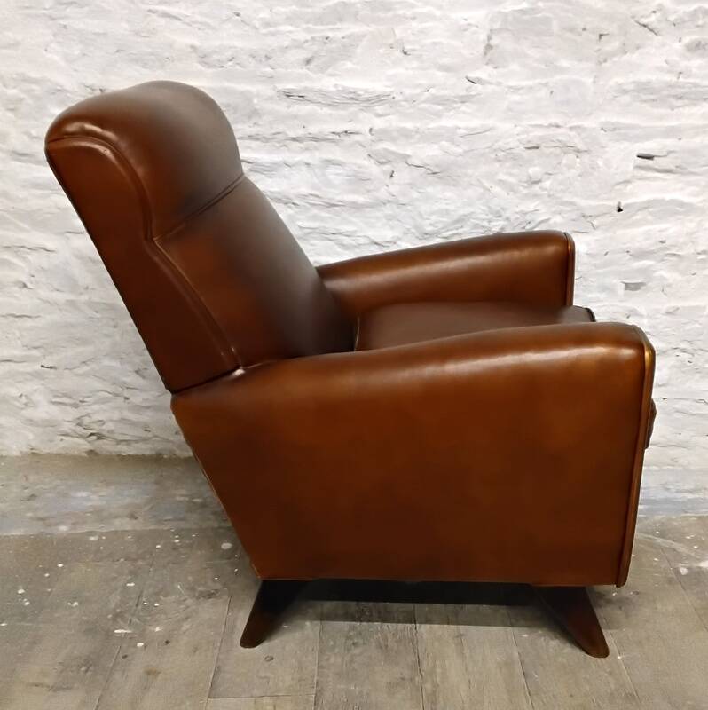 Antique club armchair from the 1950s with compass feet