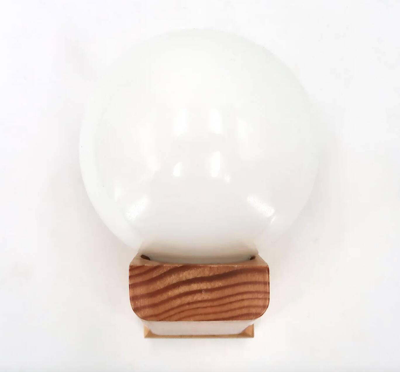 Pine wood wall light with opaque white glass globe, 1980s.