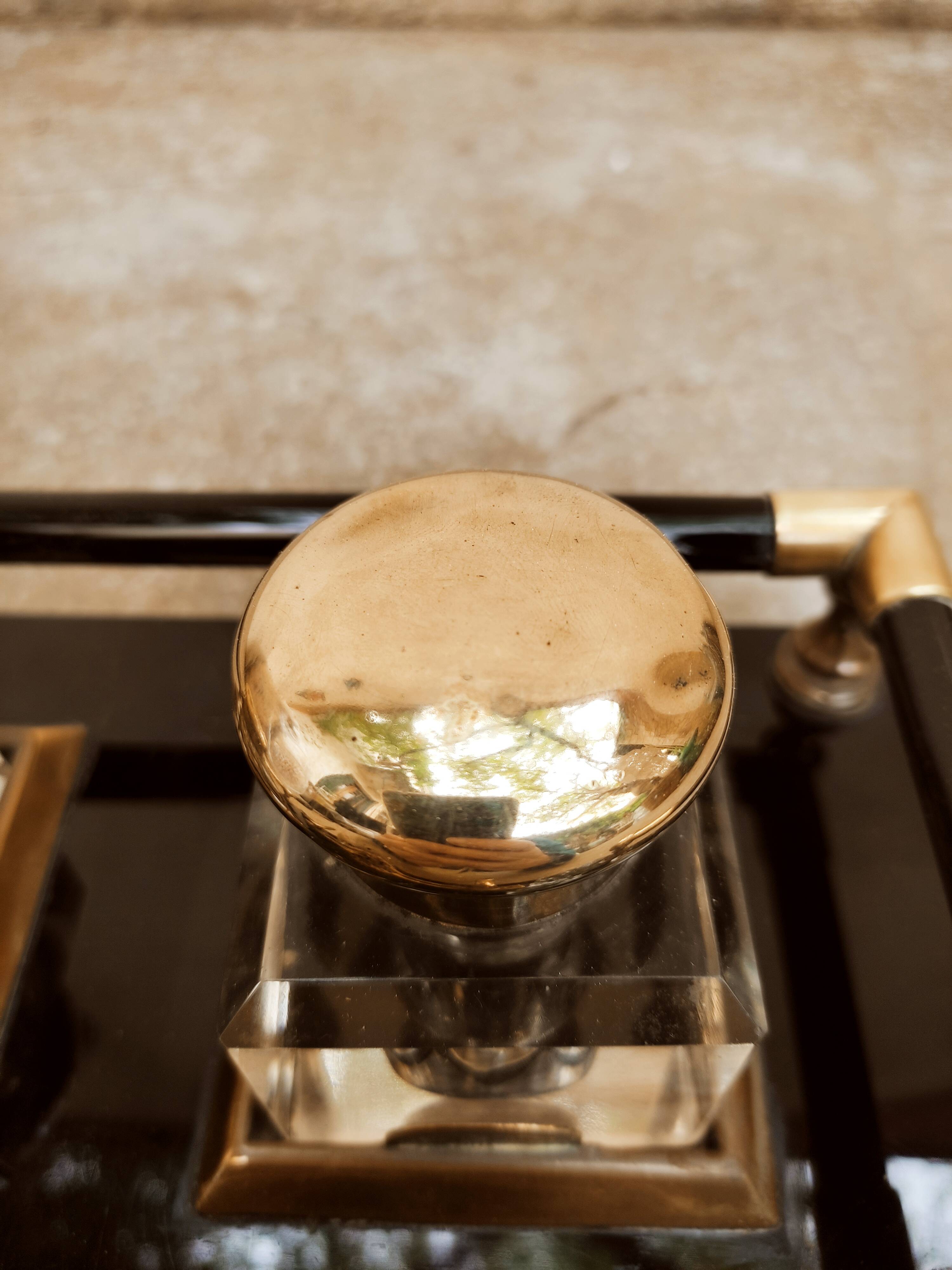 Hence the art deco inkwell on jet plate brass finishes