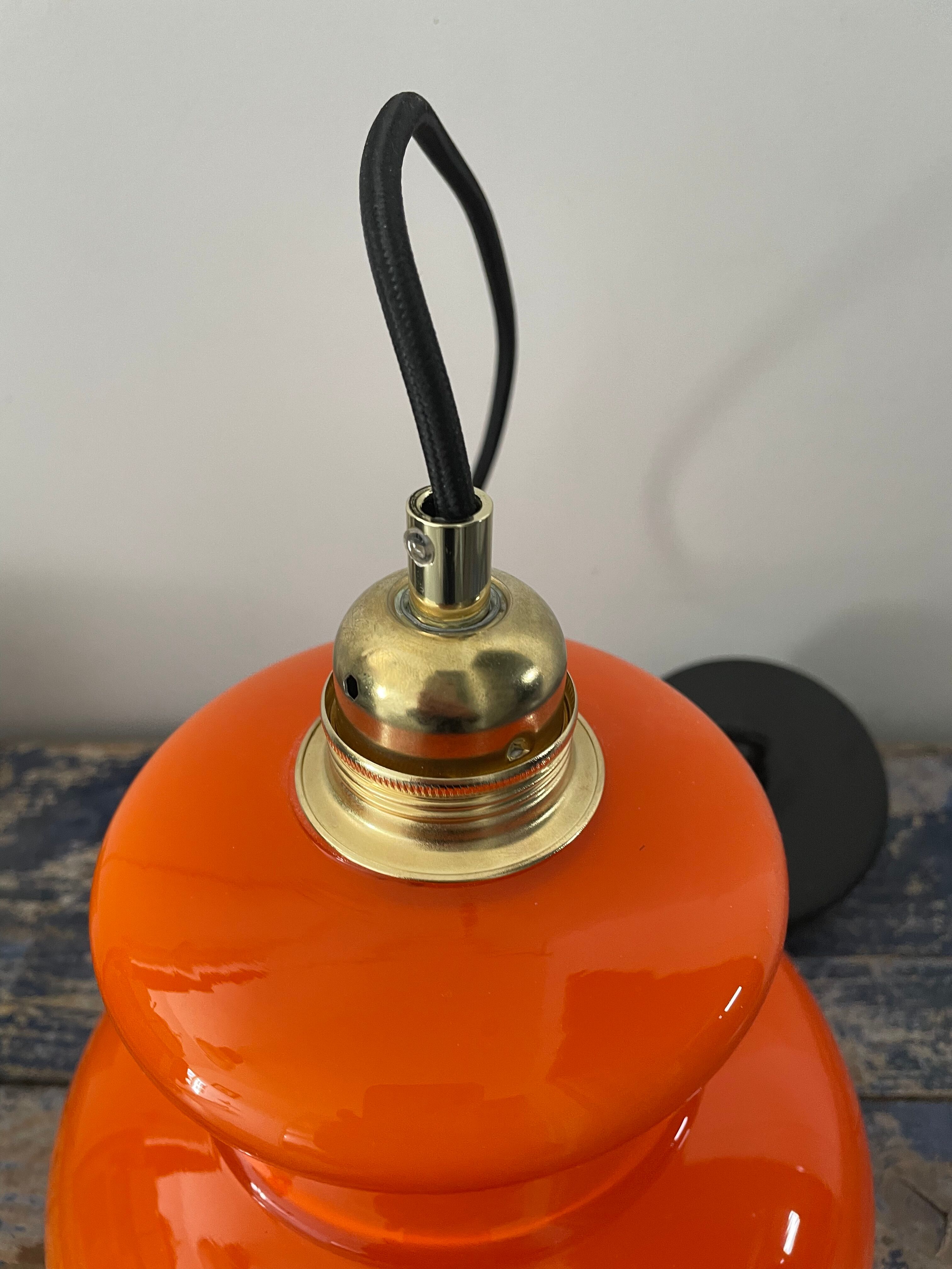 Vintage pendant lamp in electrified orange opaline to nine