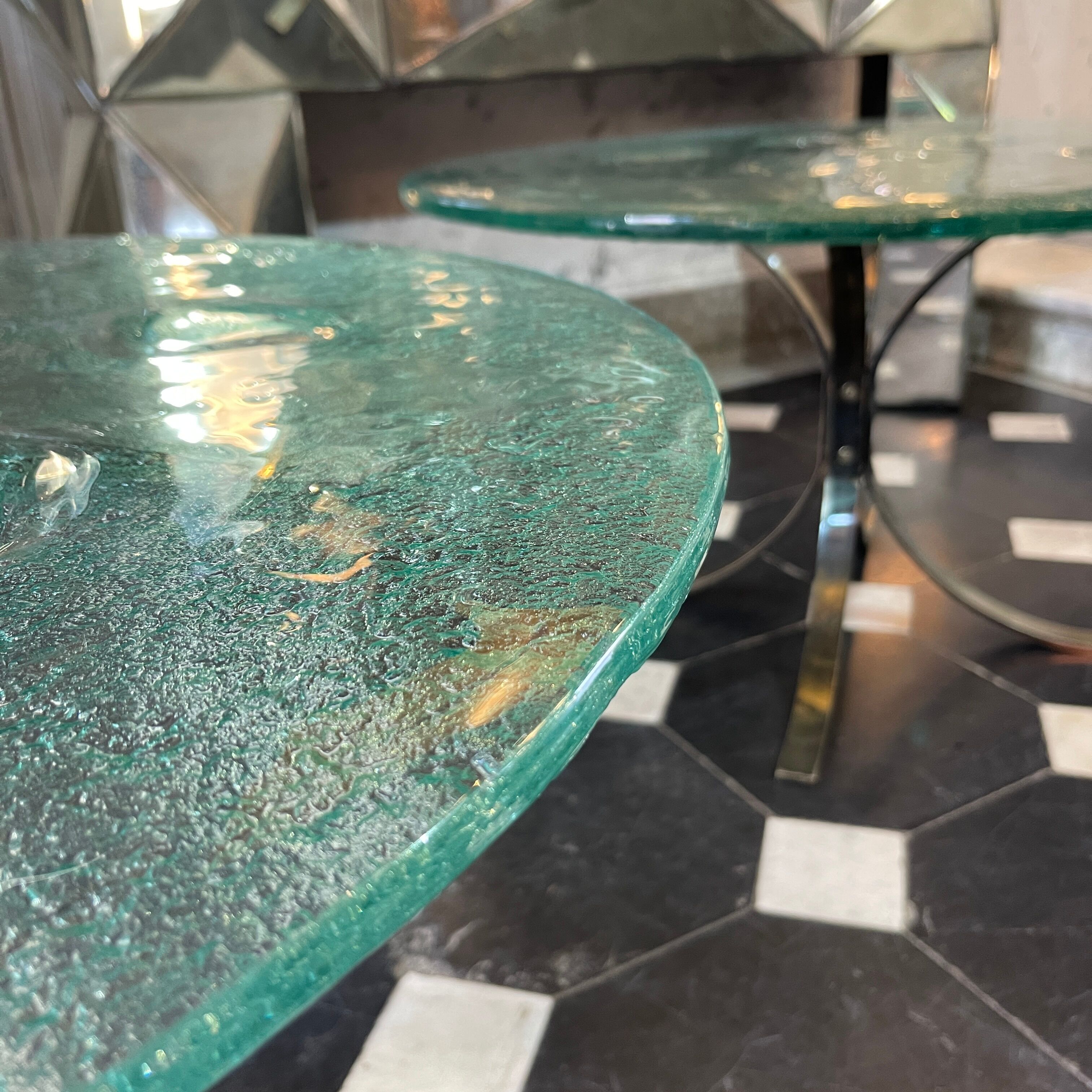 Pair of round coffee tables, glass, ca 1970