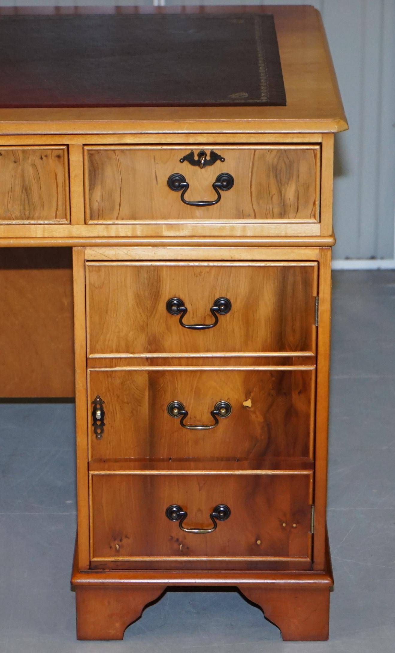 Vintage satin wood partner desk with leather top.