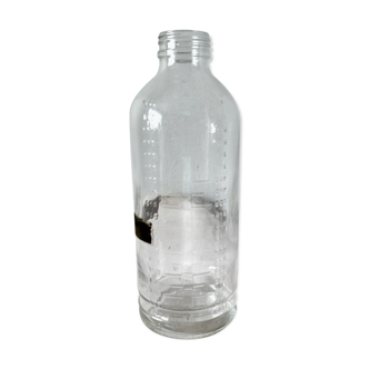 Old graduated glass bottle