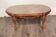 Table basse ovale style Louis XV avec plateau en verre