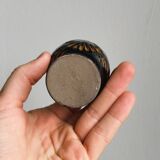 3 black ceramic egg cups, floral patterns