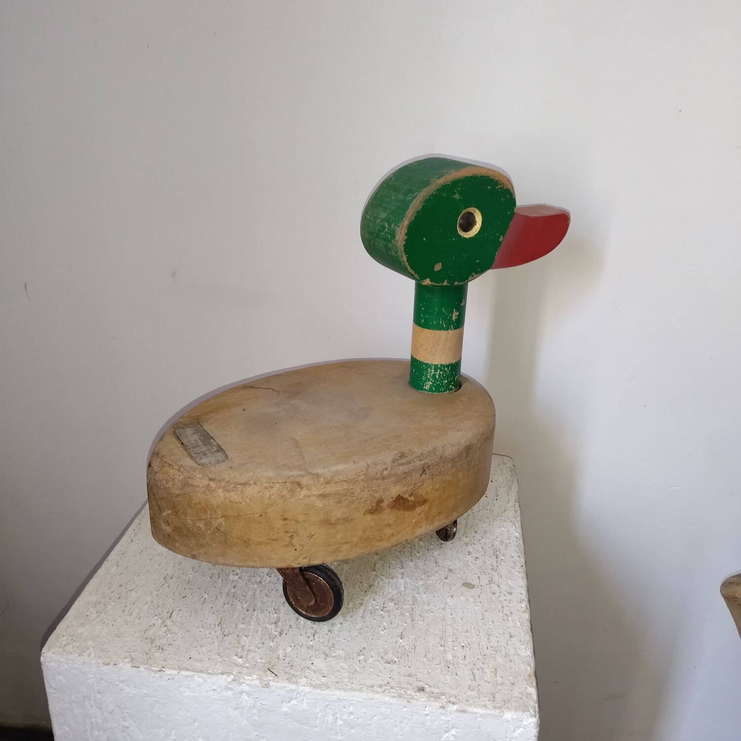 Old toy duck to pull in wood 50s