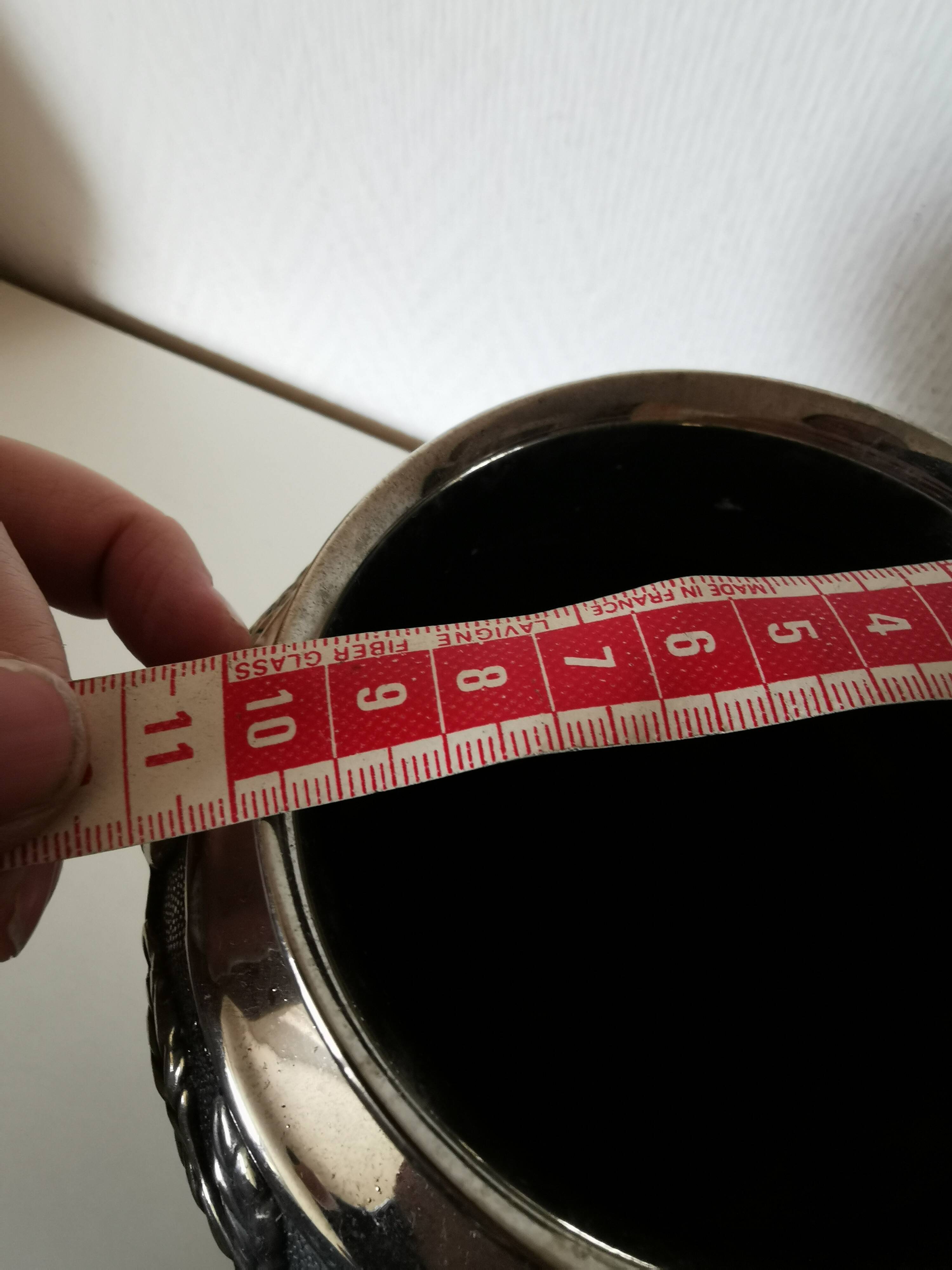 metal vase, flowers in relief