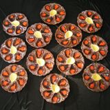 Service of 12 plates in oyster slip and its serving dish