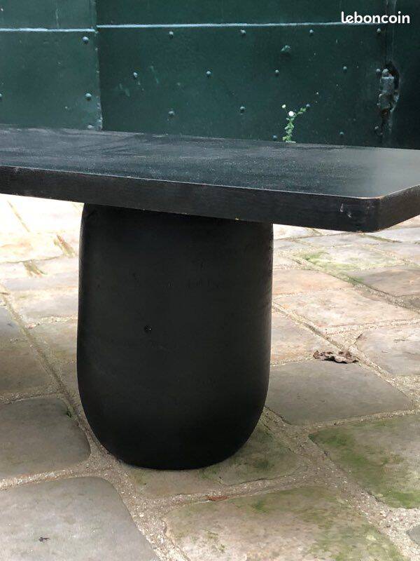 Rectangular coffee table in stained black wood with ball and cylindrical legs.