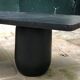 Rectangular coffee table in stained black wood with ball and cylindrical legs.