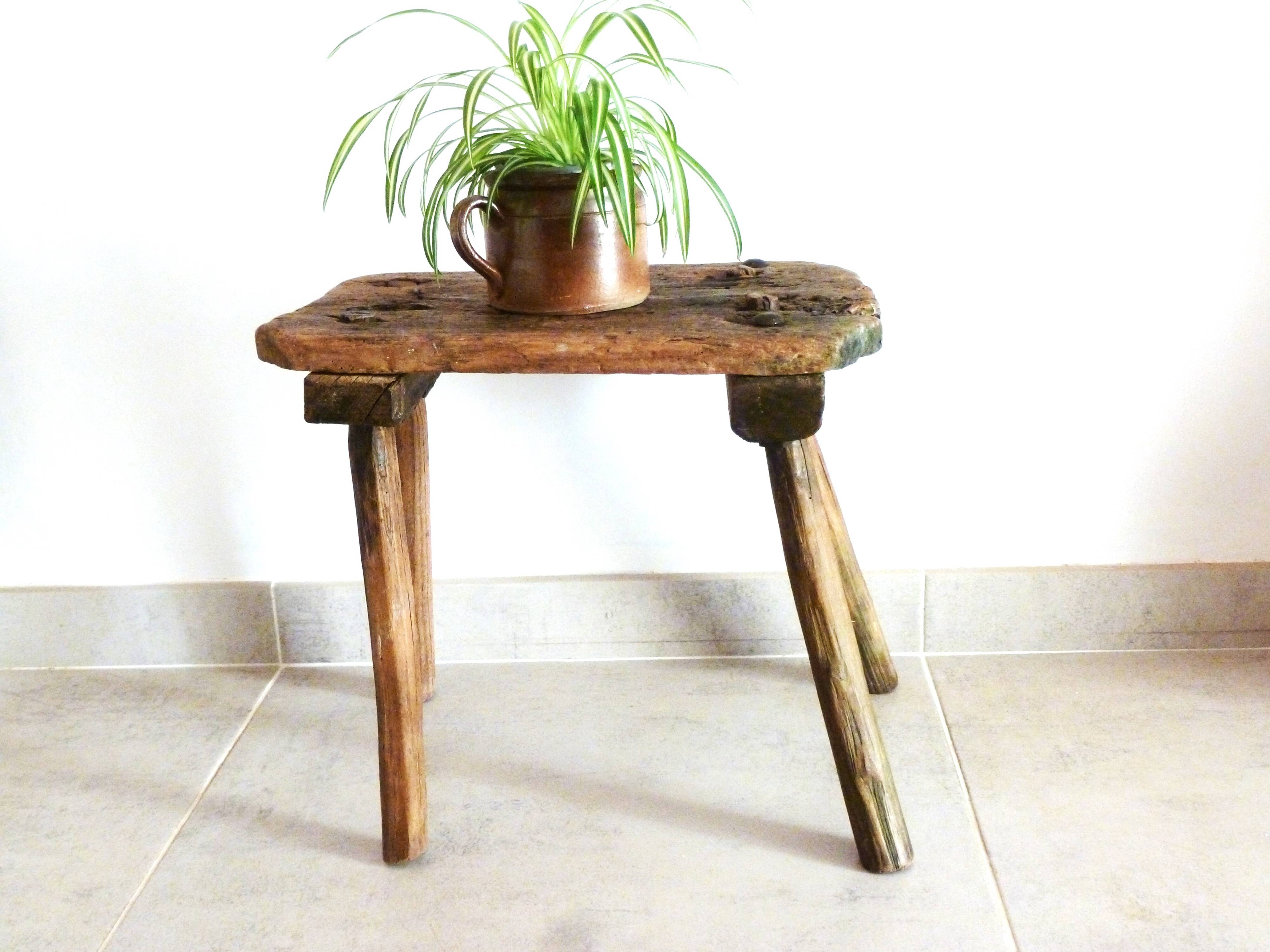 Old milking stool, old farm stool, primitive art.