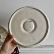 The earthenware fondue plates from Haute-Provence.