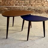 Pair of tripod and nesting coffee tables in walnut and midnight blue