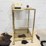 Vintage rolling table in brass and smoked glass