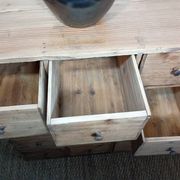 Industrial or apothecary workbench with 30 vintage wooden drawers.
