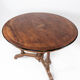 Round dining table of walnut with inlaid wood, 1890s