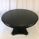Table circulaire en bois noirci, pied central balustre