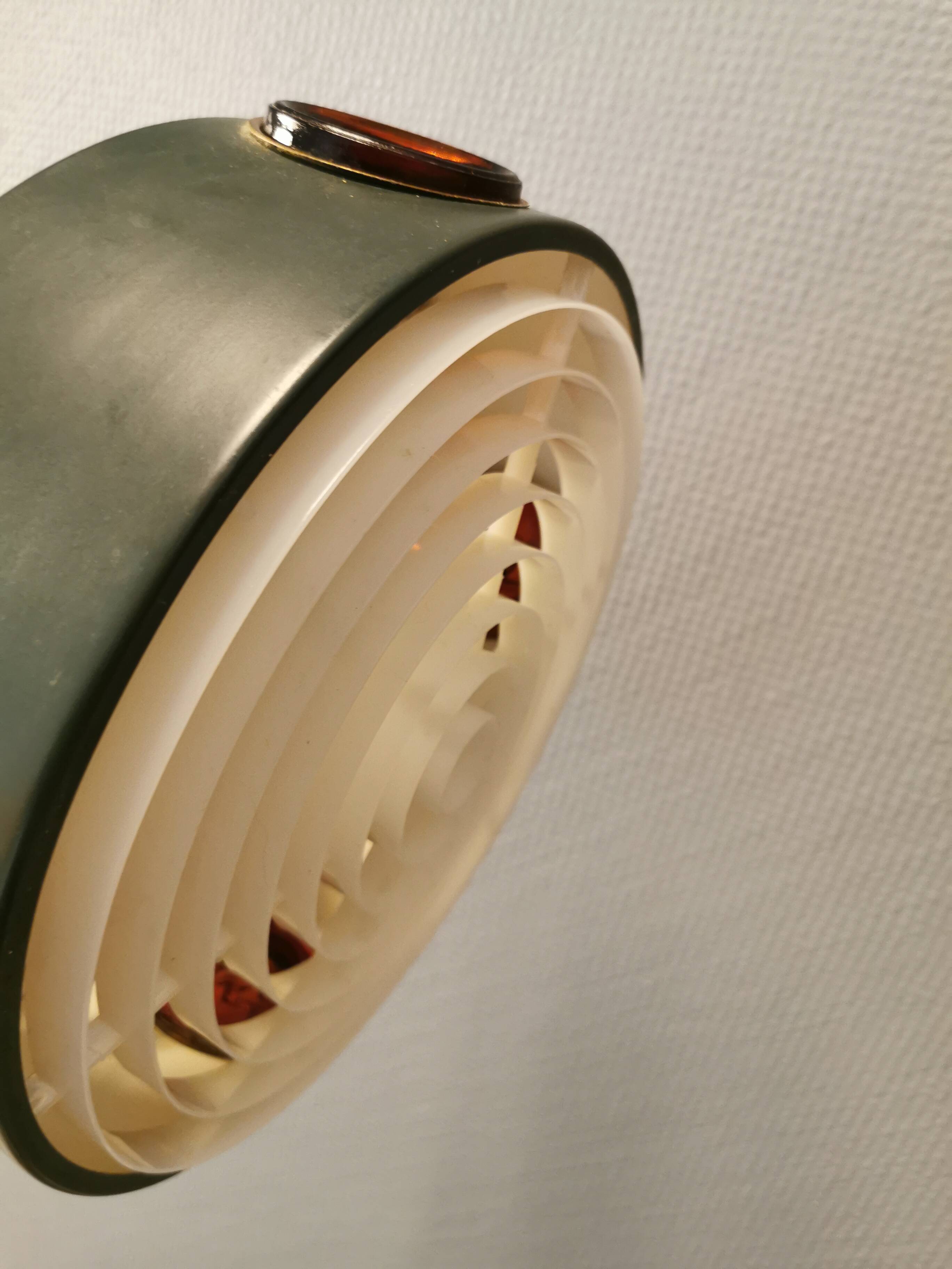 Swedish hanging lamp, in dark green lacquered metal with red glass prisms and brass top/suspension.