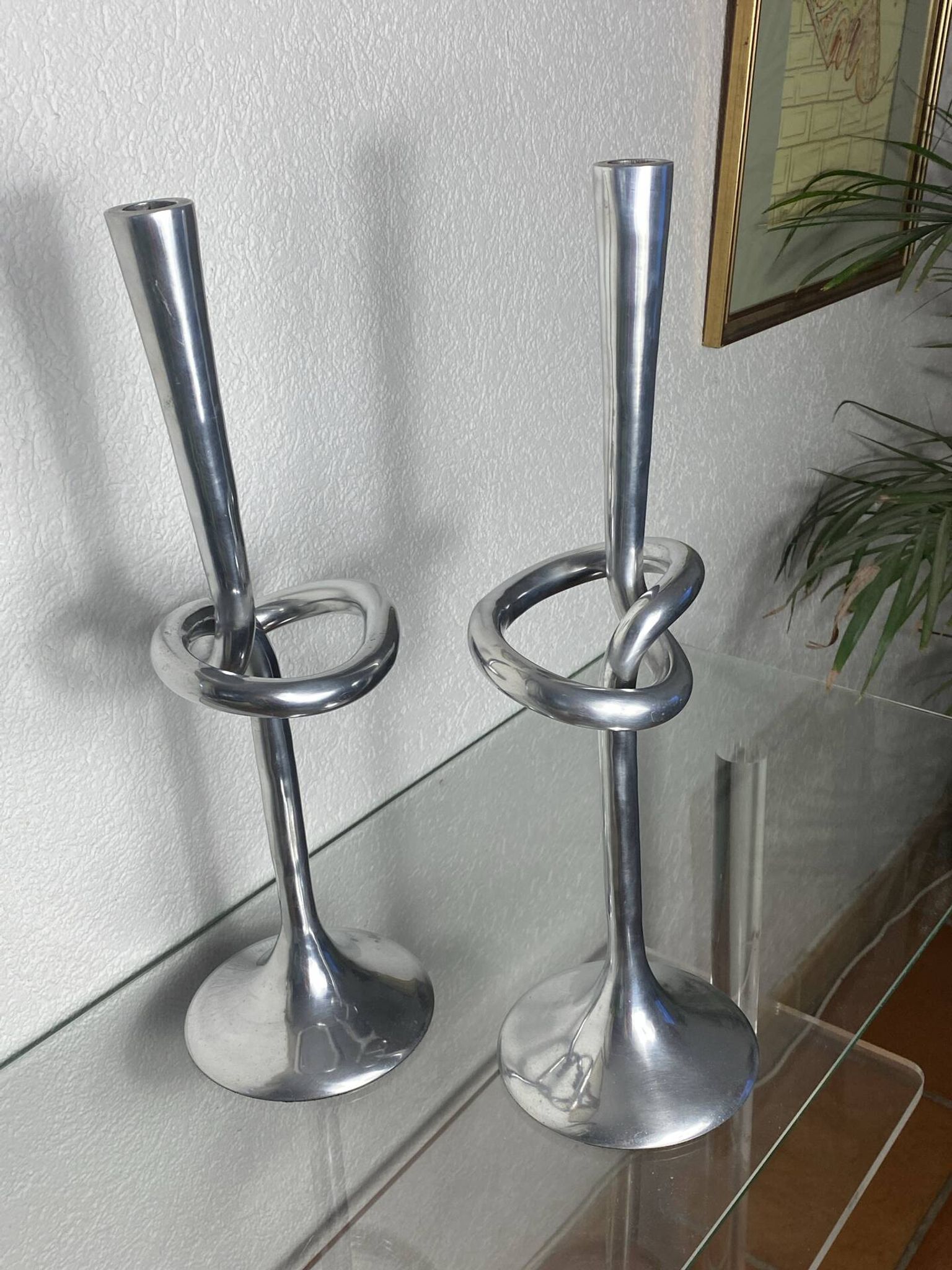 Pair of large aluminium bow candlesticks, Italy, 1970.
