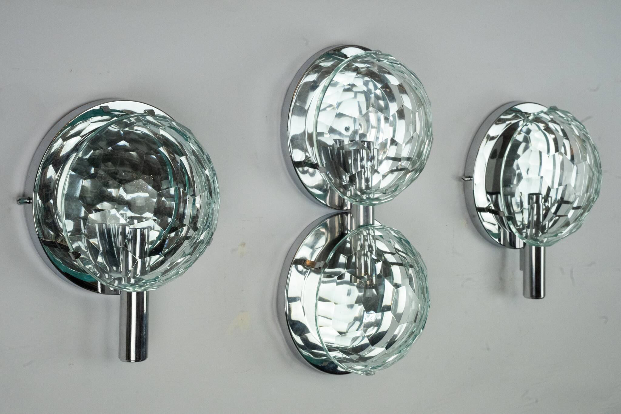Set of three Cristal Art sconces in chrome and cut glass. Italy 1970s