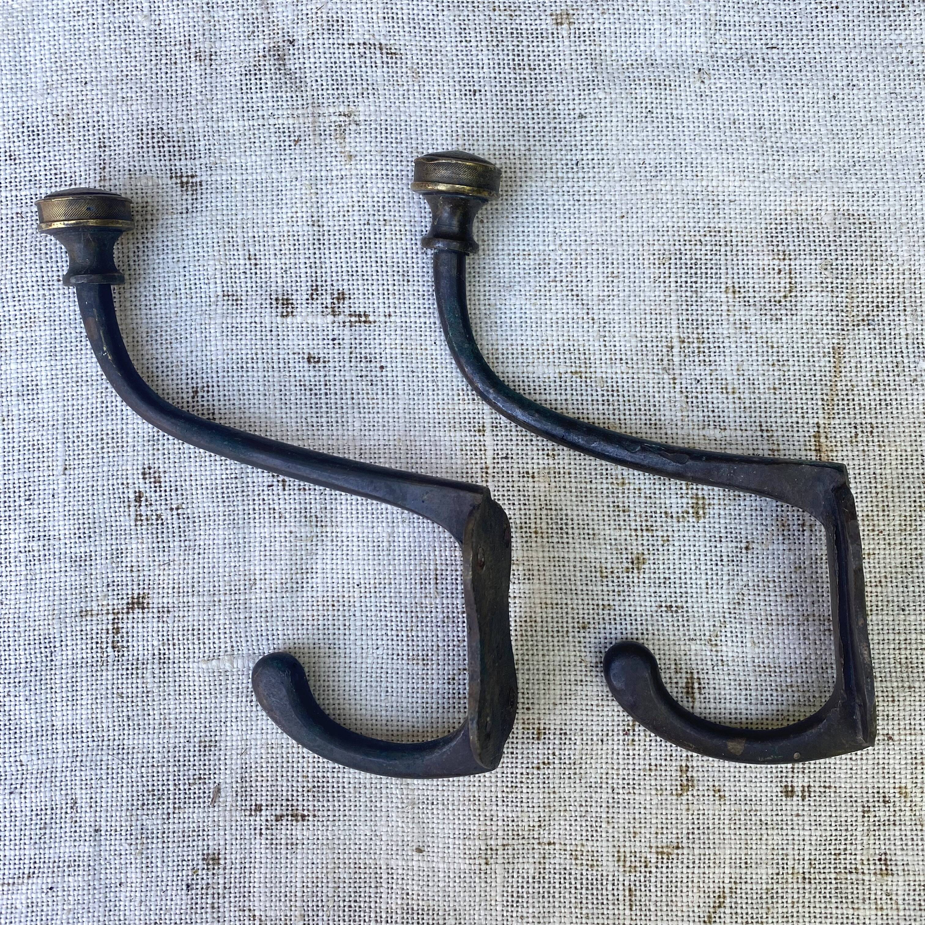 Antique metal and brass coat hooks