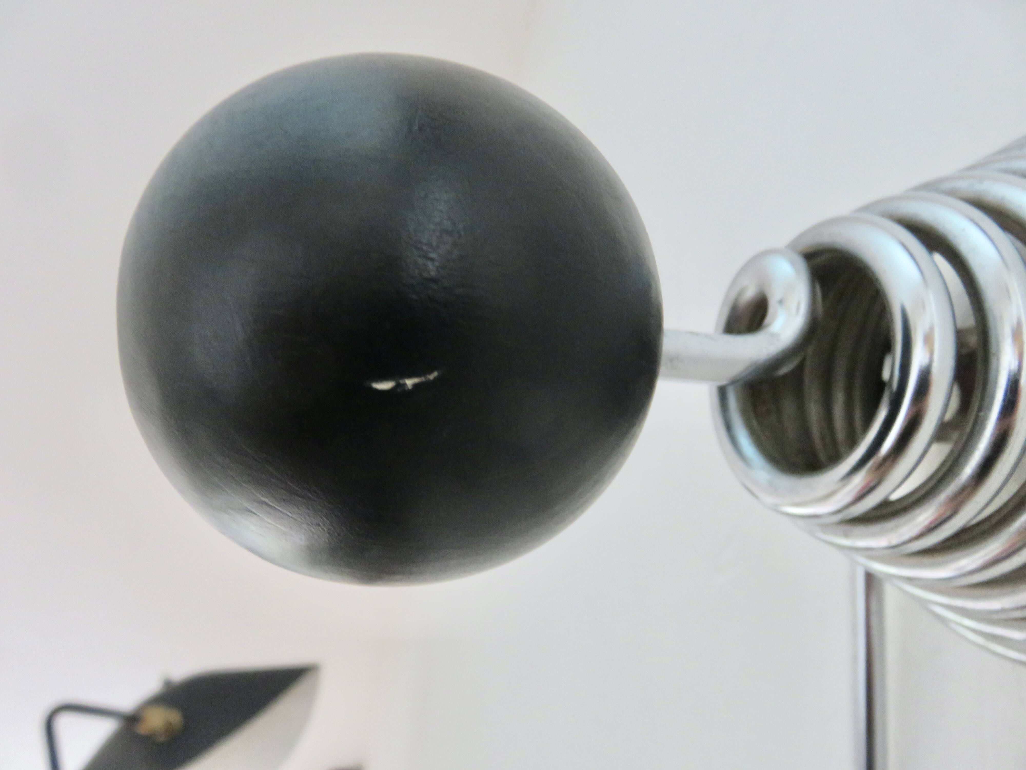 "Streamline" wall coat rack in chromed metal and black lacquered wood, 1970.
