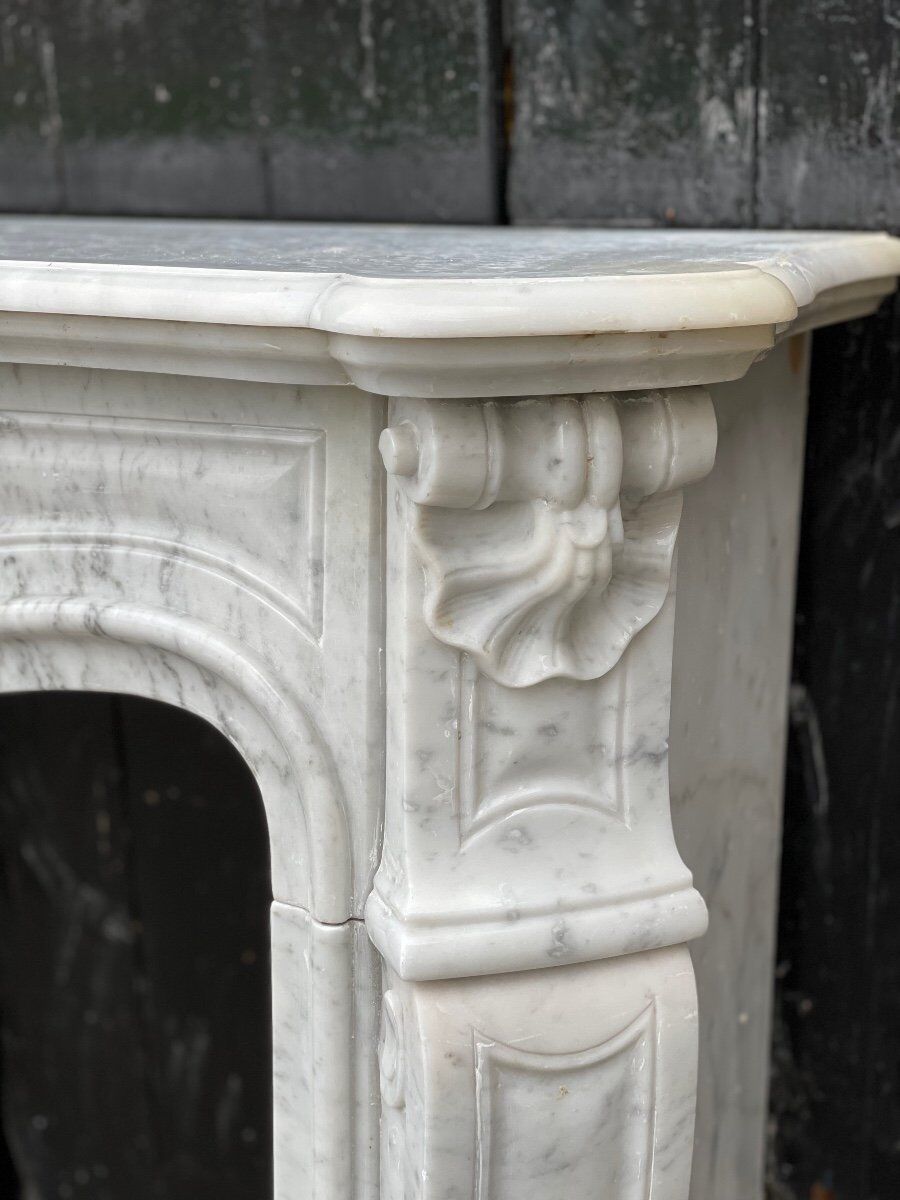 Louis XV style fireplace in Carrara marble