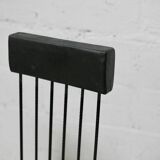 Brutalist chair, black-stained raw wood, steel. Work from the 1970s