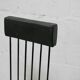 Brutalist chair, black-stained raw wood, steel. Work from the 1970s