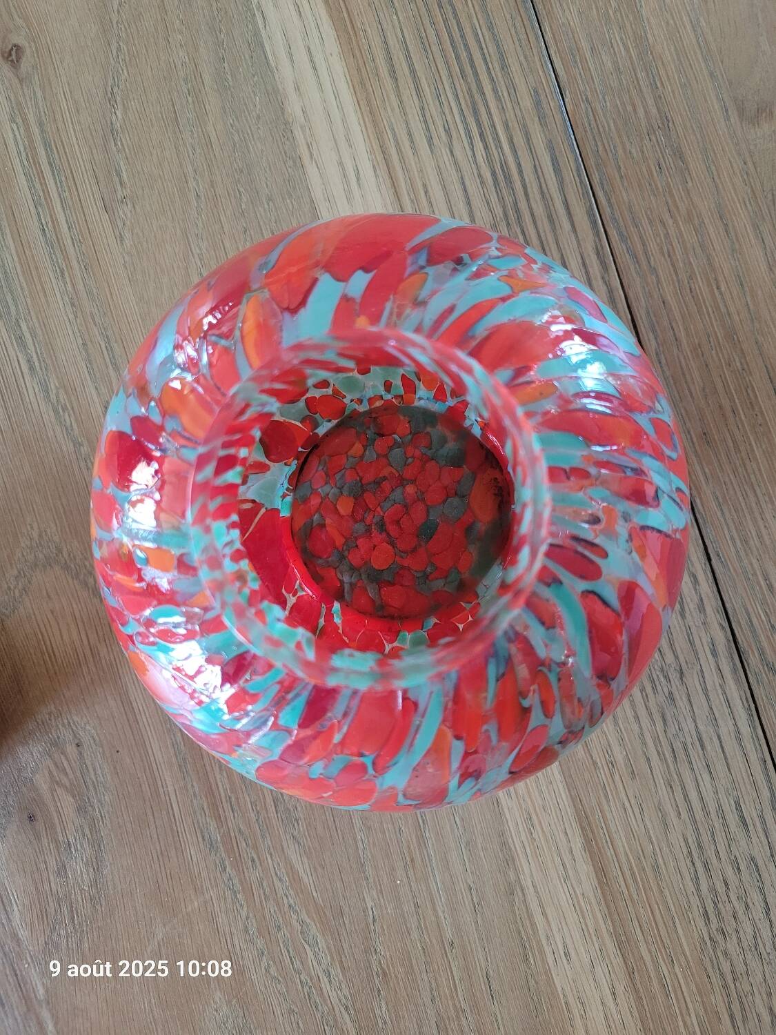 Old multicolored glass flower vase