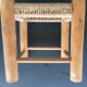 Wooden stool seated in braided rope