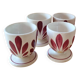 Set of four Digoin-style egg cups