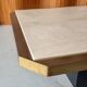 Coffee table in brass and travertine.