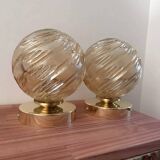 Pair of golden globe wall lights