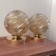 Paire d’appliques globes dorés